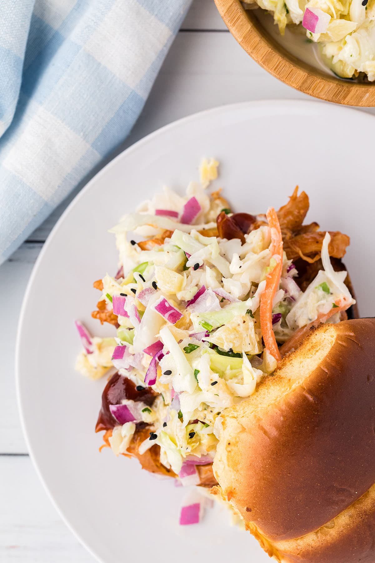 Hawaiian coleslaw on a pulled pork sandwich