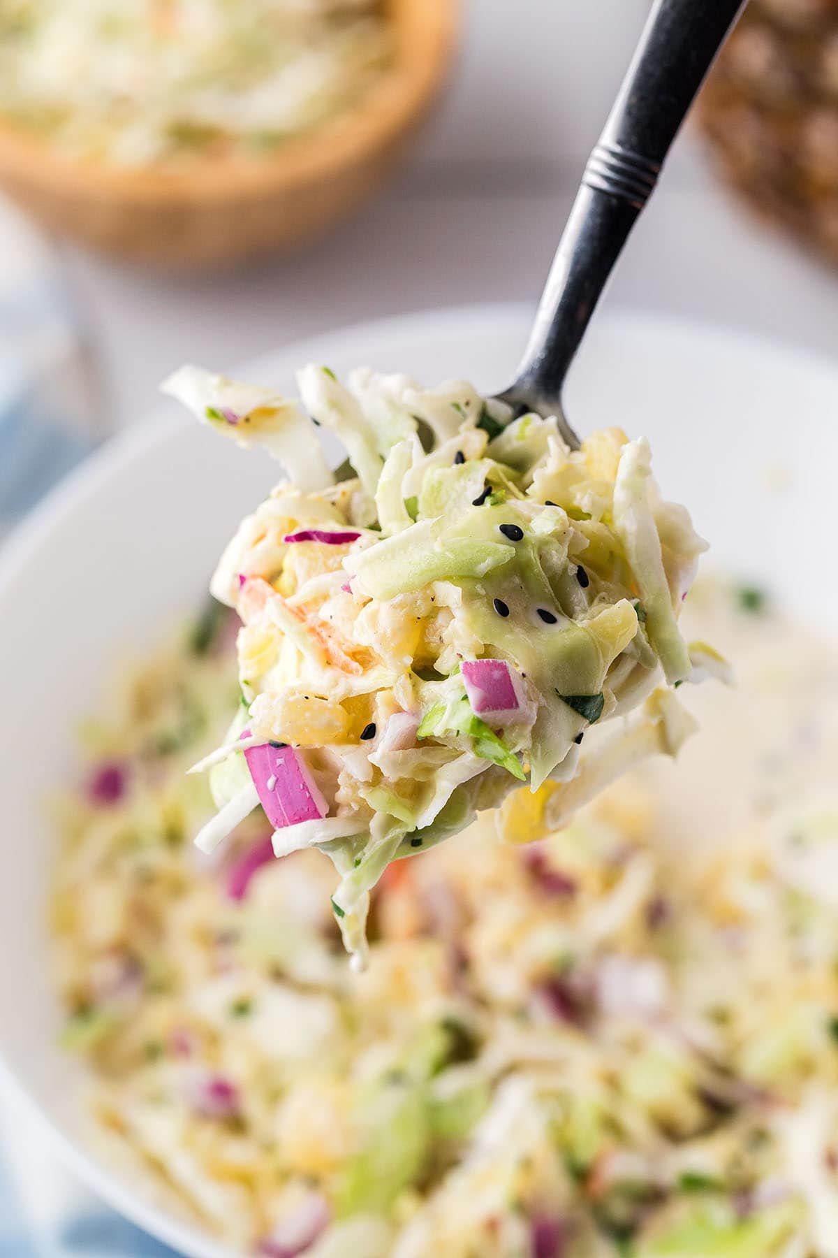pineapple coleslaw on a serving spoom