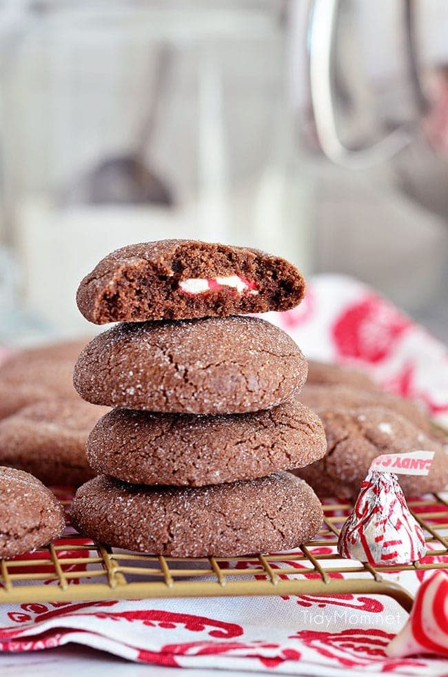 Super soft chocolate cookies hold a peppermint kiss in the center in these Peppermint Surprise Crinkle Cookies. Find the recipe at cetcu.com