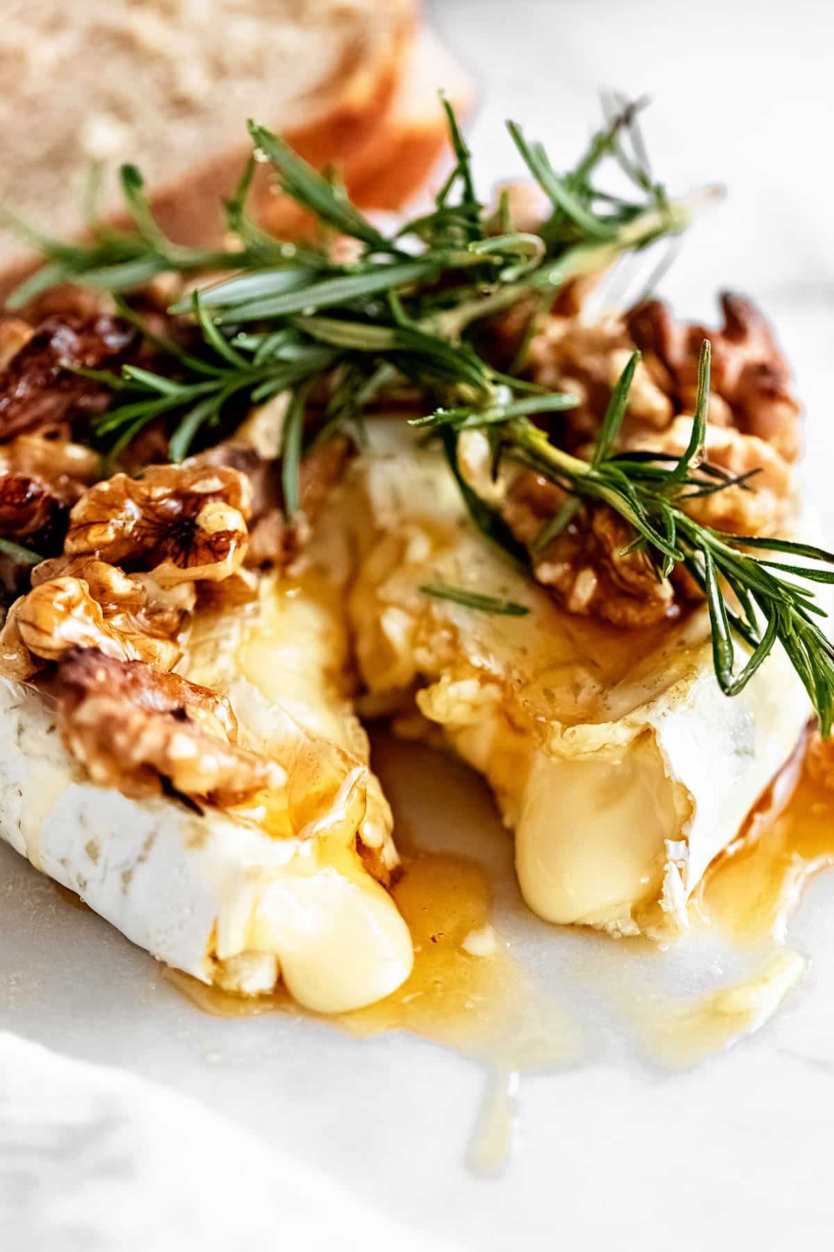 baked brie appetizer cut open with cheese oozing out