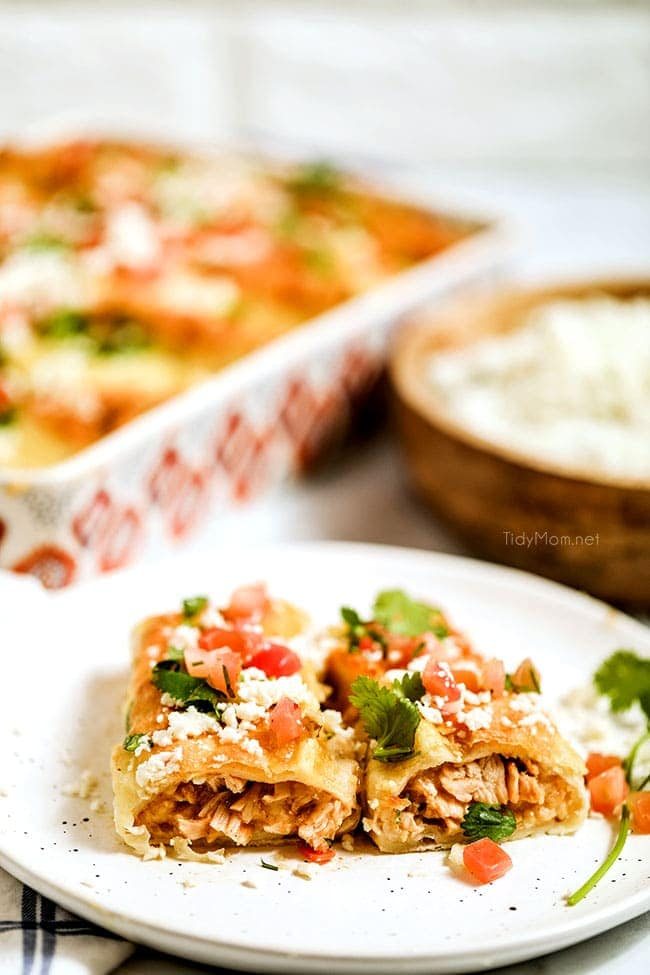 cheesy enchiladas on a plate