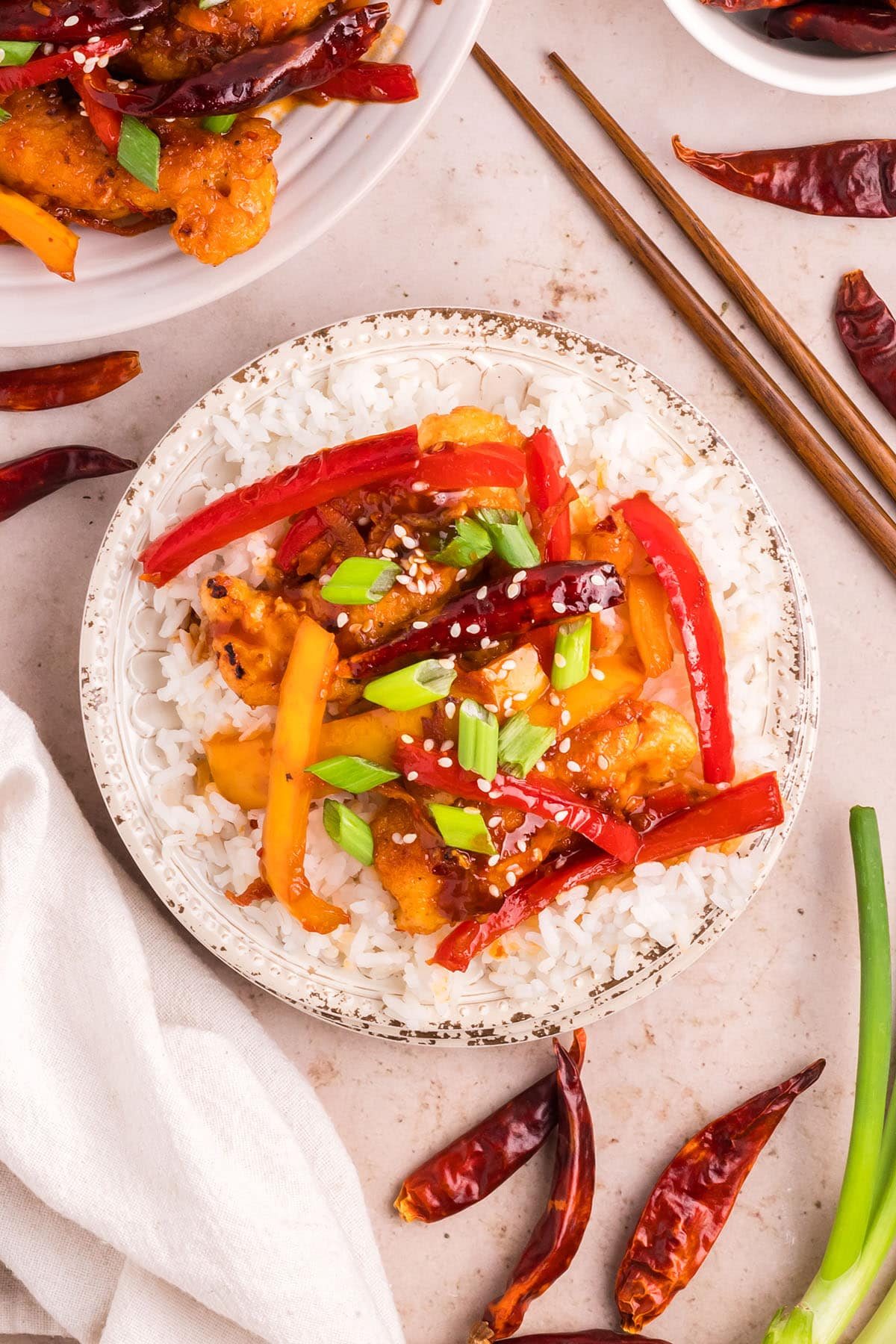 hot and spicy chicken with white rice on a plate