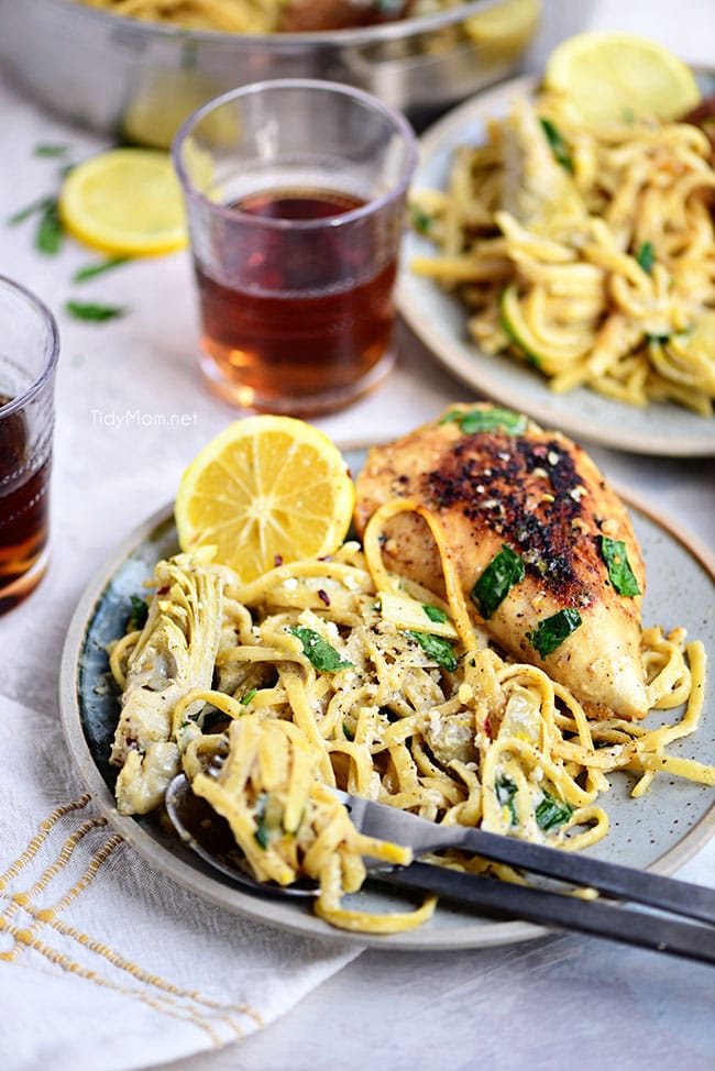 artichoke pasta with a chicken breast on a plate