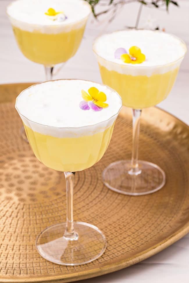 Three dessert cocktails on a tray
