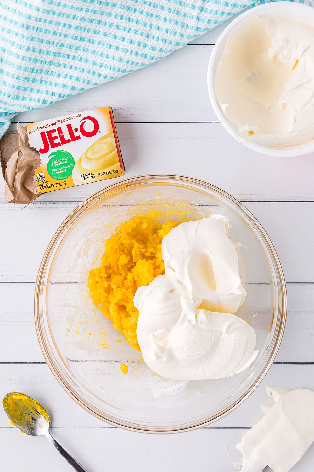 pineapple frosting ingredients in glass bowl