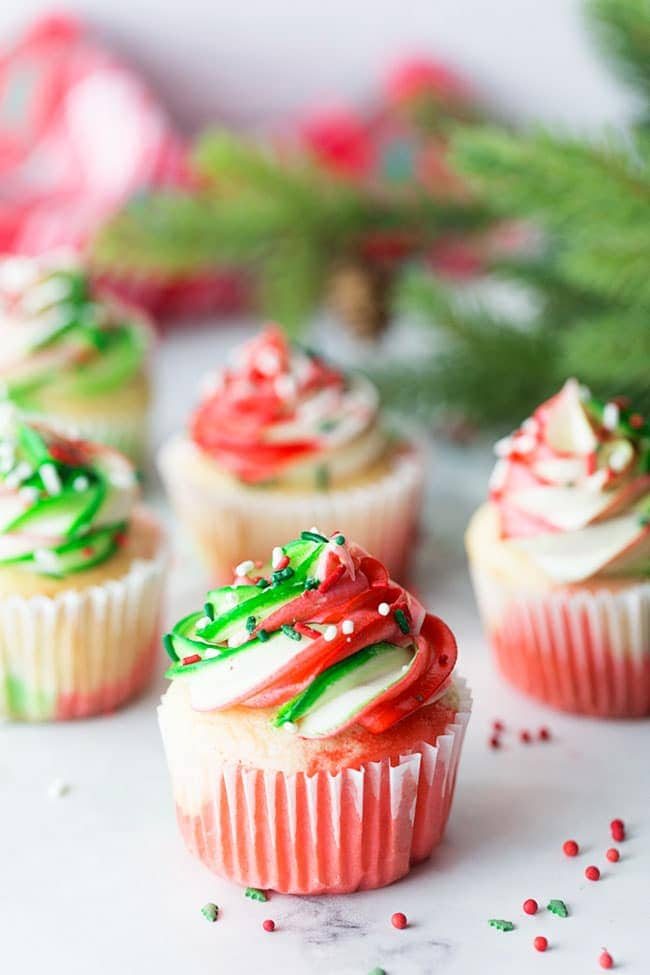 Very Merry Tricolor Christmas Cupcakes in red, green and white with a hint of peppermint! See how to make these fun colorful marble cupcakes and frosting at cetcu.com