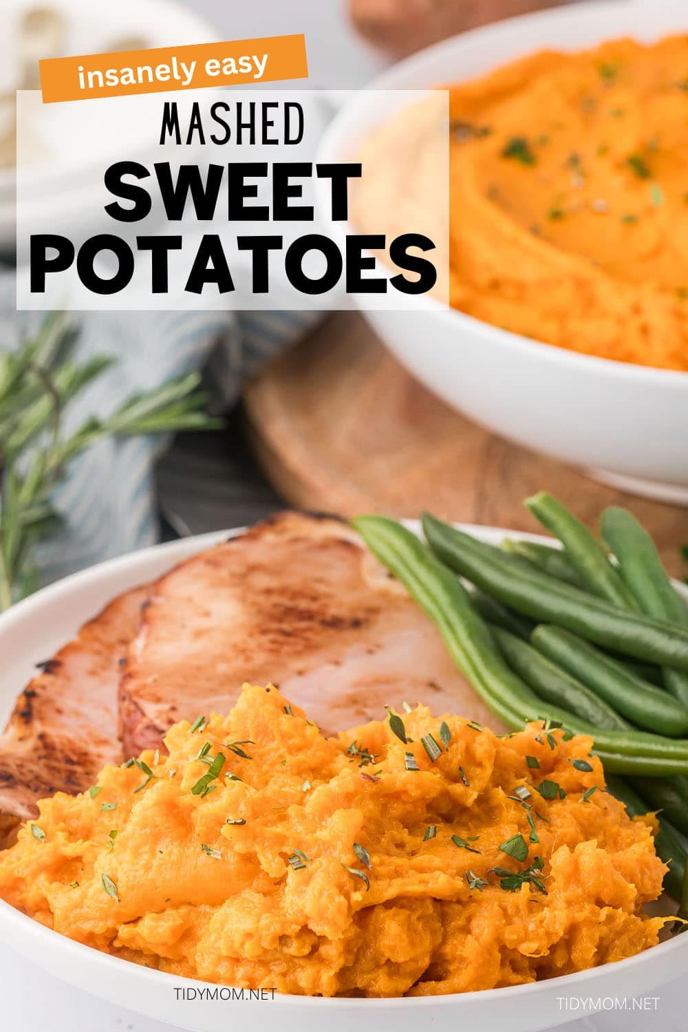 mashed sweet potatoes with green beans and ham on a plate and a bowl in the background