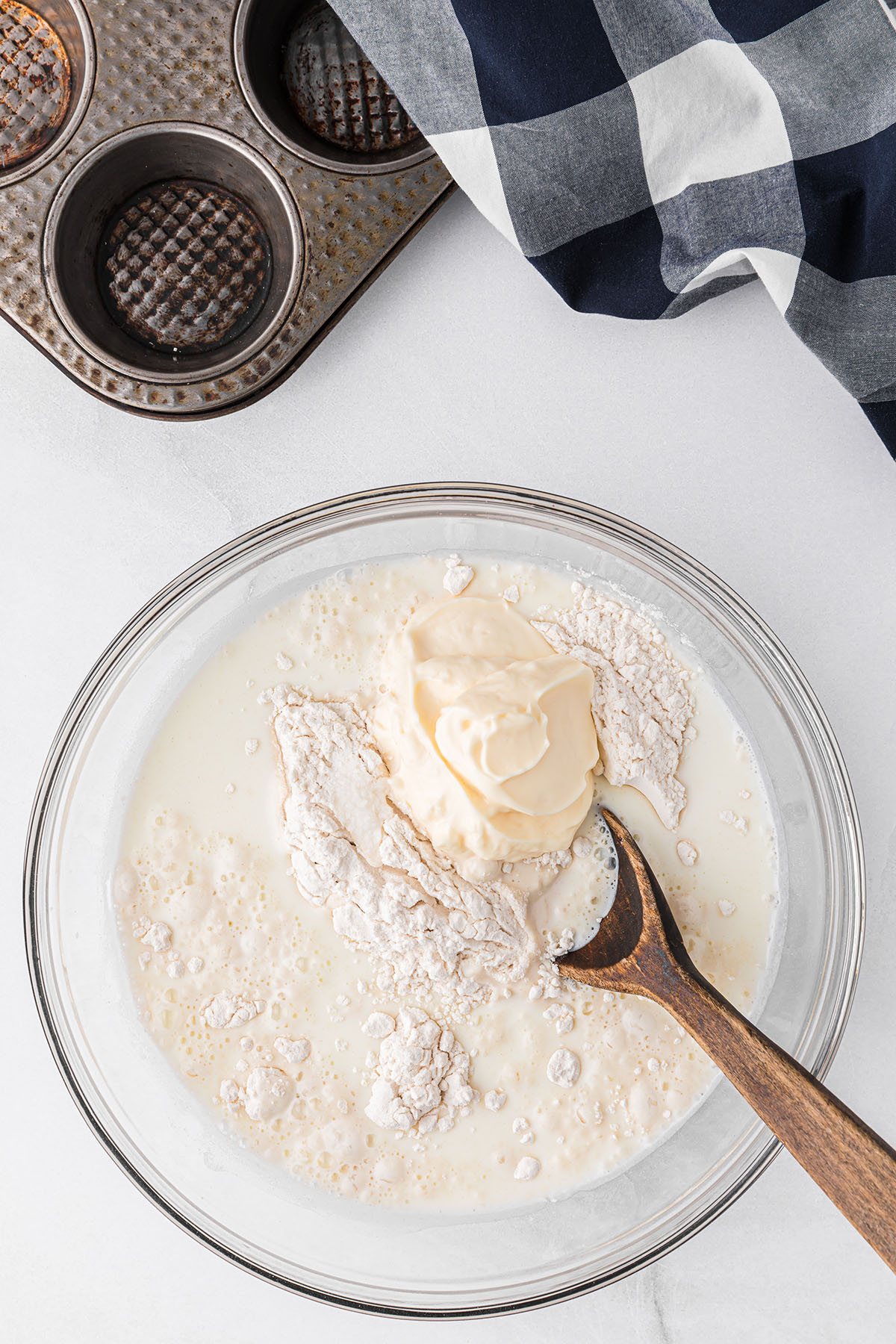 mixing batter in a glass bowl