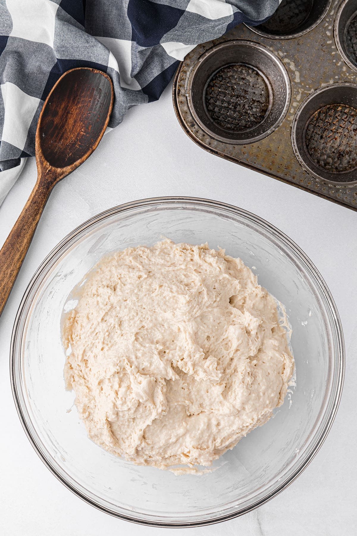 biscuit dough in a glass mixing bowl