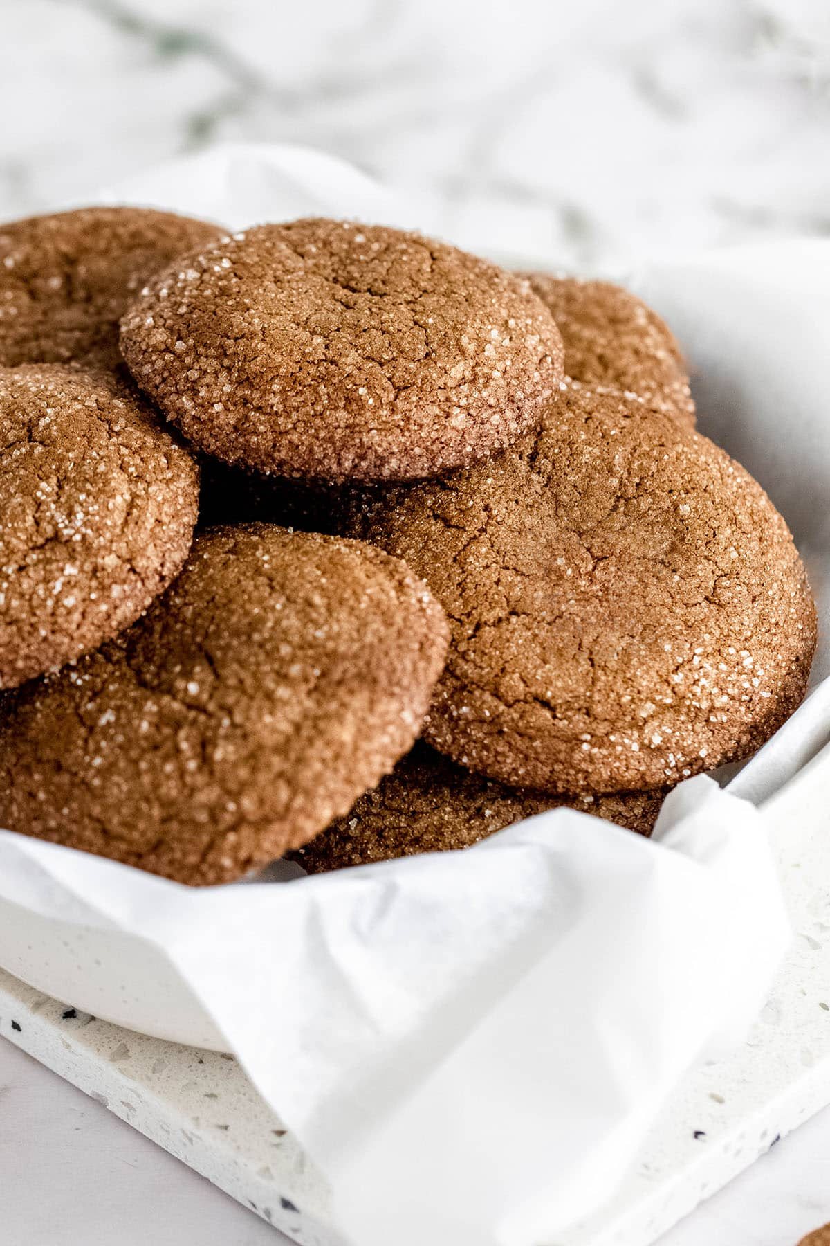 cookies in a tin with a white napkin