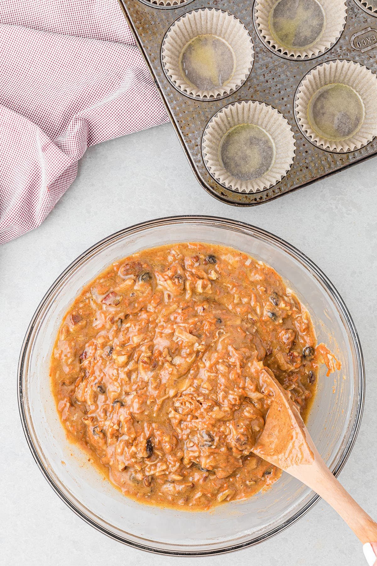 morning glory muffin batter in a glass bowl