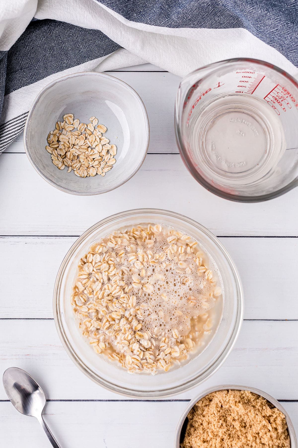 old fashioned oats soaking in a bowl of water