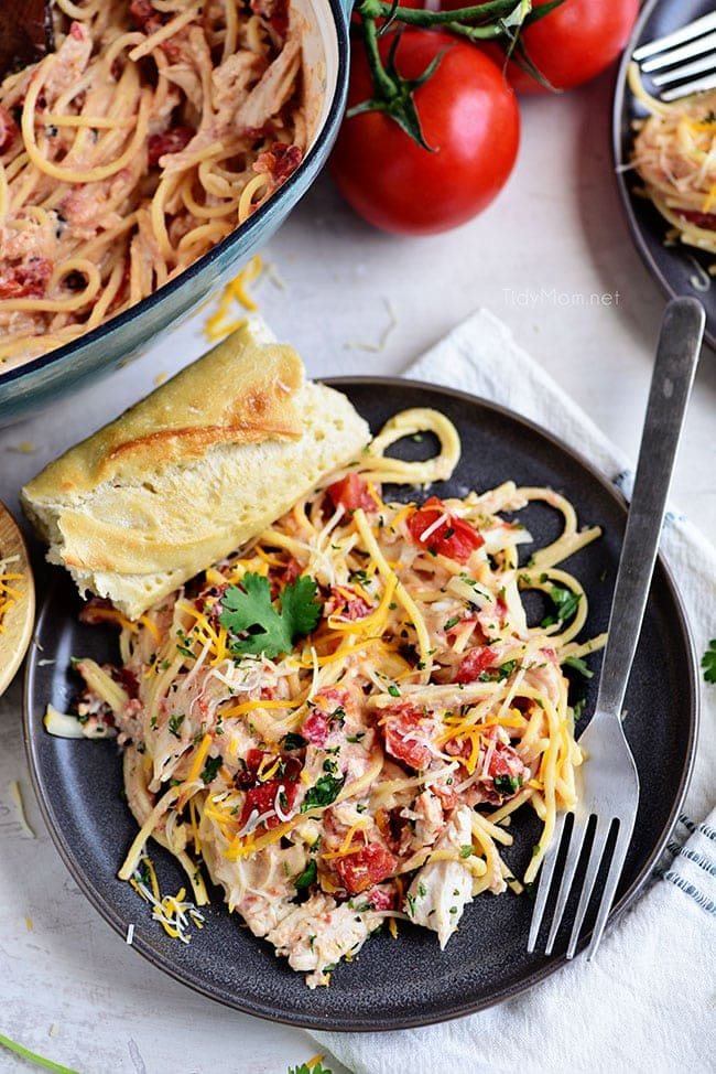 Creamy One-Pot Chicken Spaghetti on a gray plate with french bread
