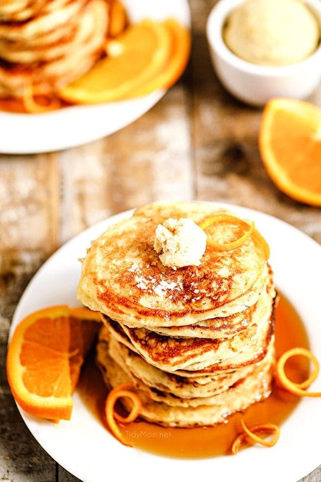 stack of orang pancakes on a plate