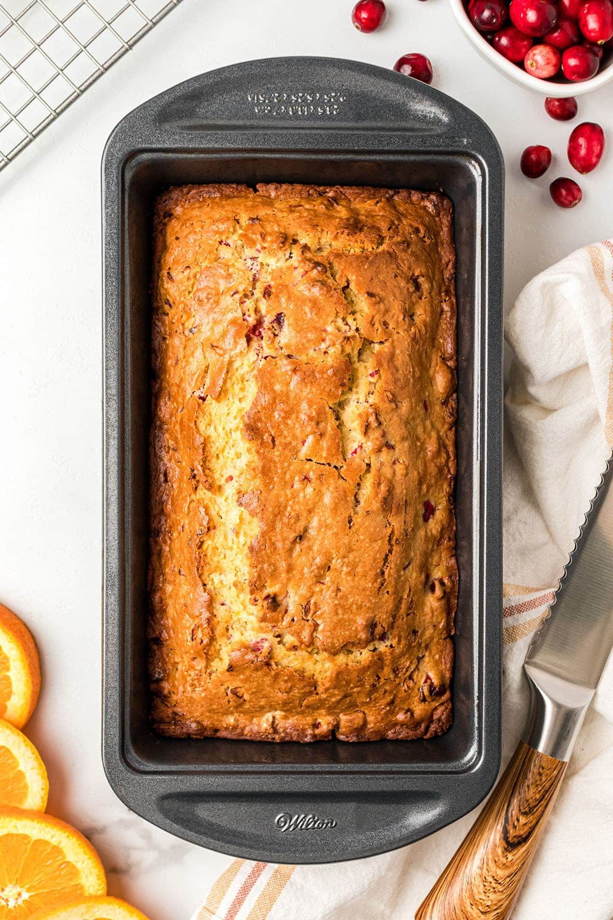 Baked Orange Cranberry Bread in a metal loaf pan