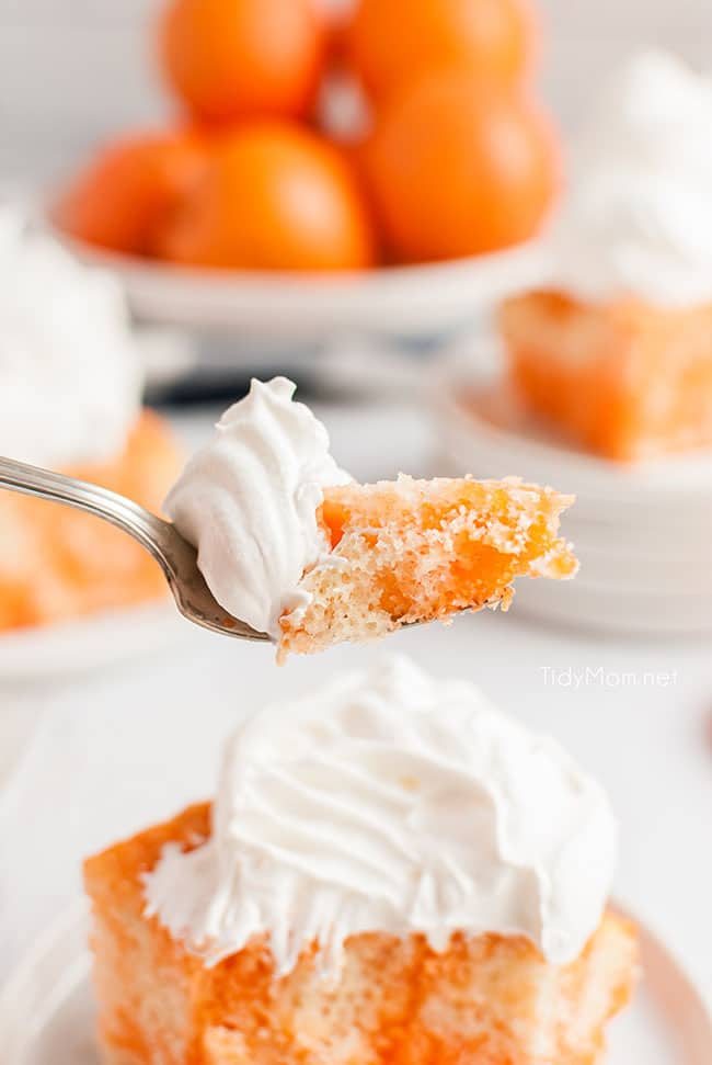 orange jello cake bite on a fork