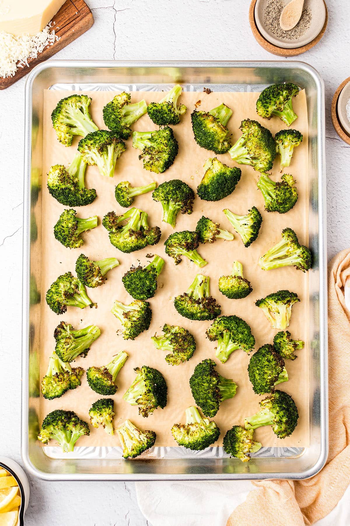 roasted broccoli on a baking pan just out of the oven