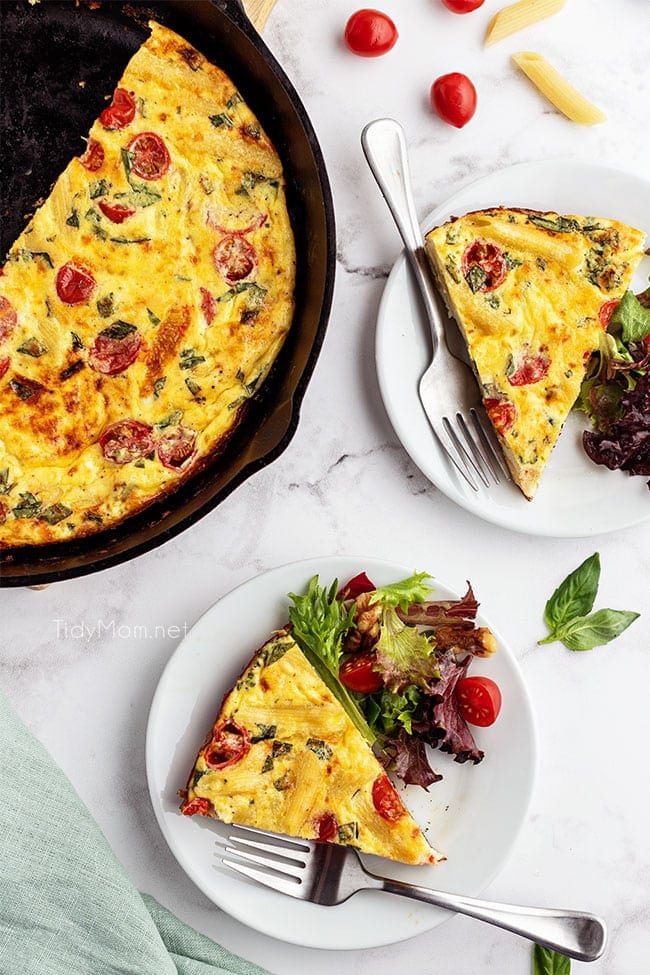 frittata in cast iron skillet and slices on plates