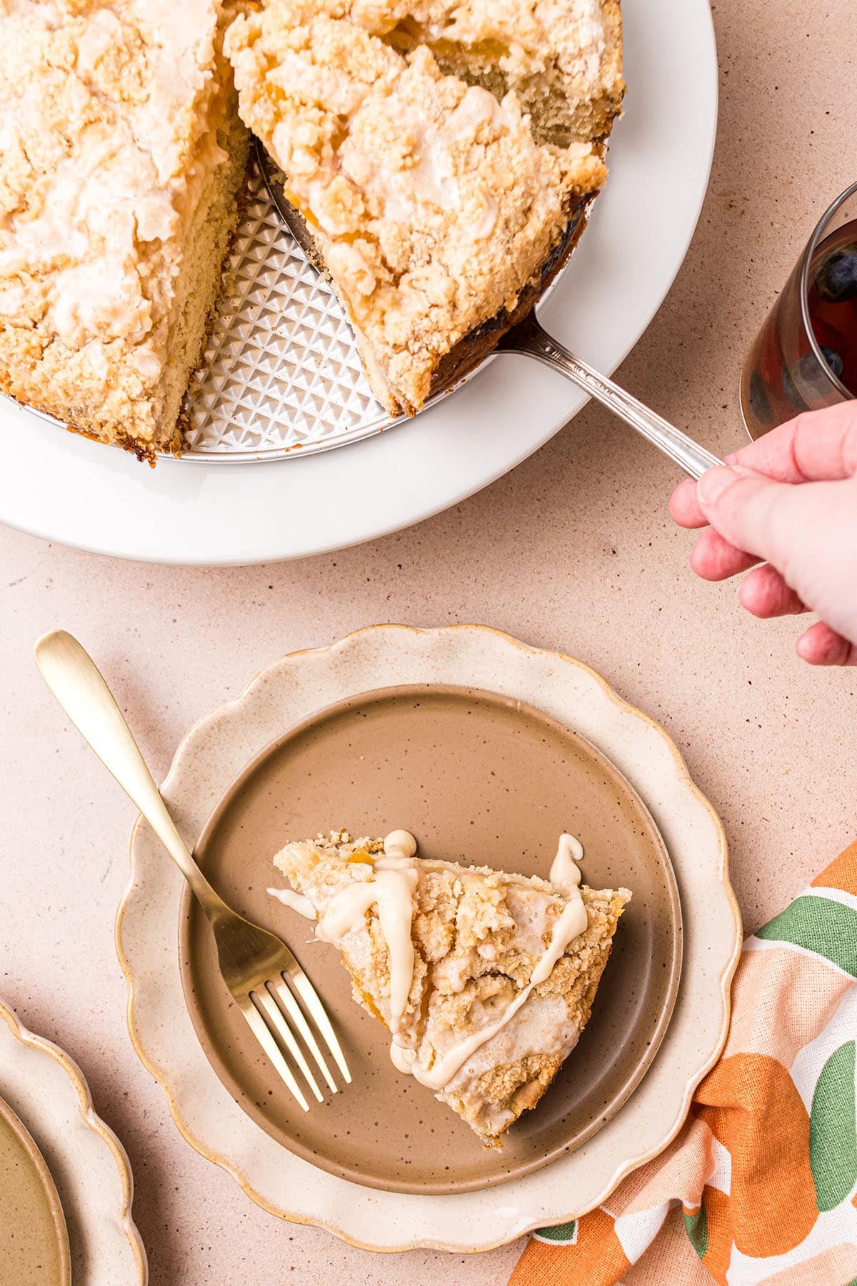serving peach coffee cake on plates with forks