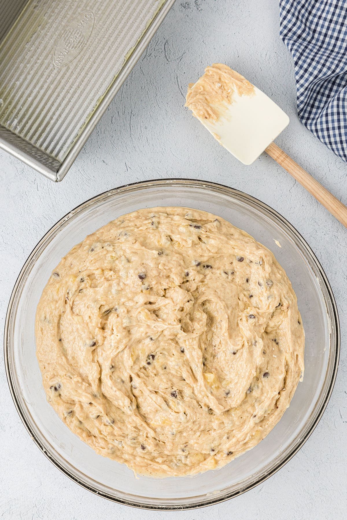 Peanut Butter Banana Quick Bread batter in a glass bowl