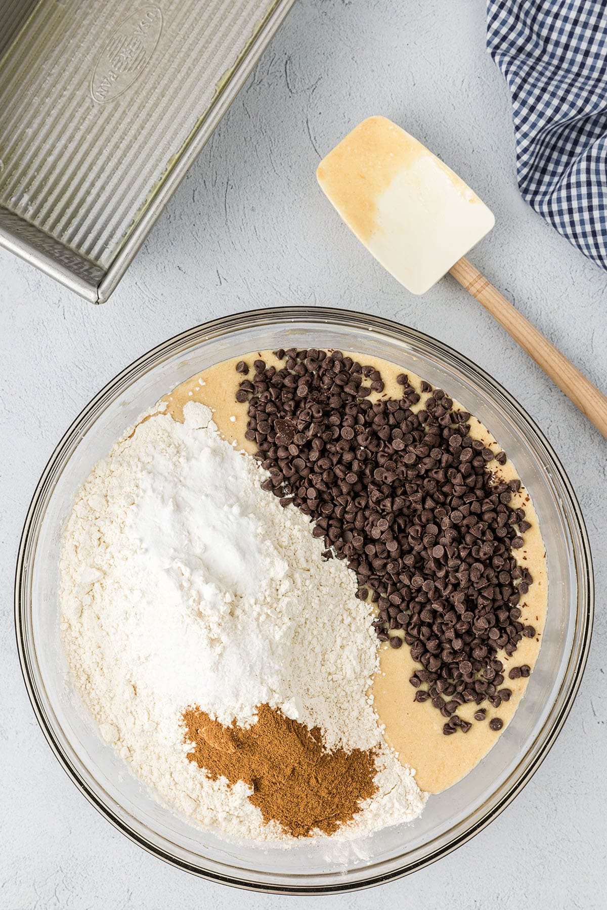 mixing up quick bread in a glass bowl