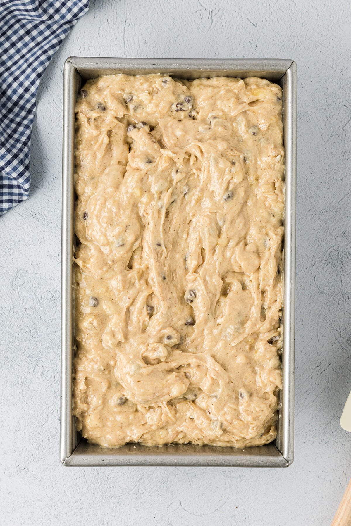 Peanut Butter Banana Quick Bread batter in a loaf pan