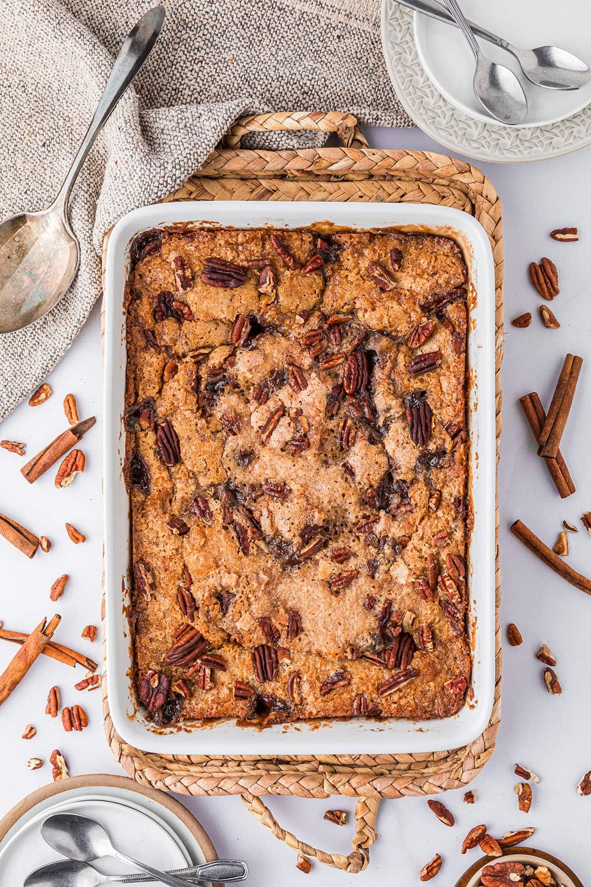 pecan pie cobbler in a white baking dish