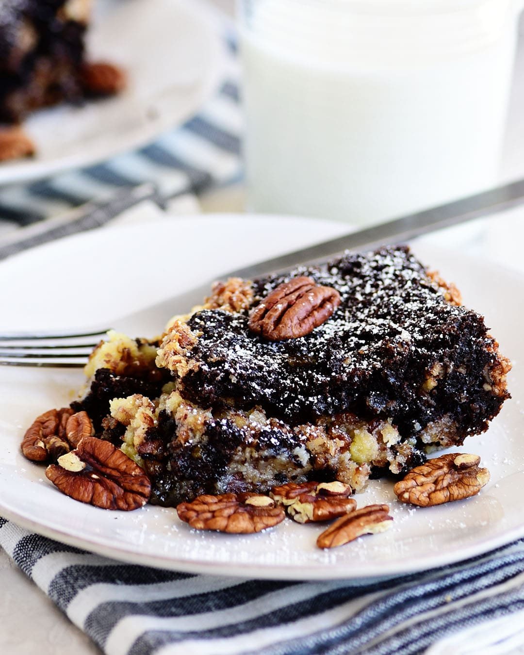 Pecan Pie Gooey Butter Cake on a white plate