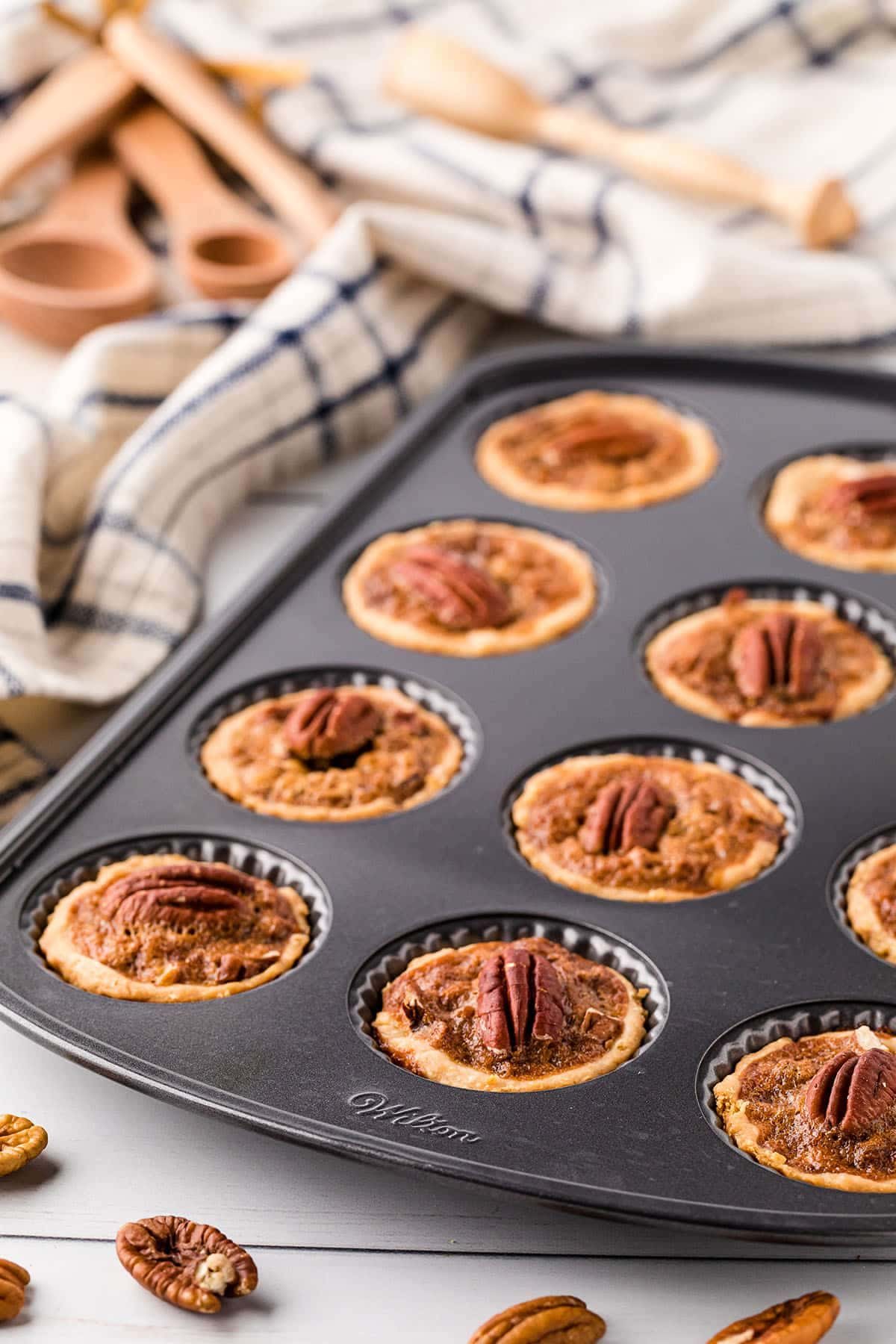a pan of pecan tassies just out of the oven