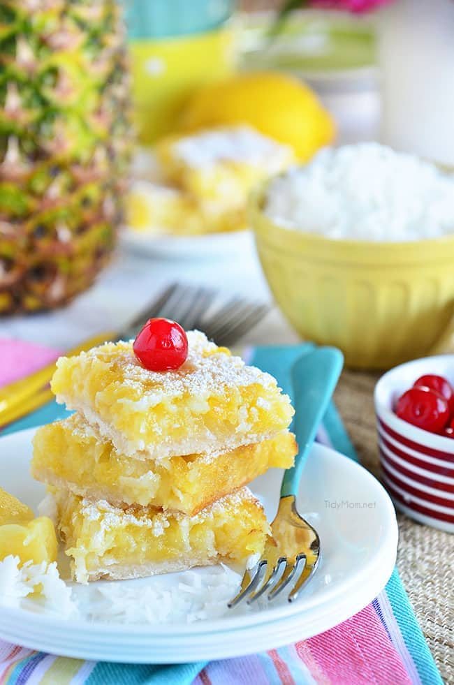 Channel the tropics, lounging on a white sandy beach, with these Pina Colada Bars. Enjoy the flavors of coconut and pinaple and consider it your ticket to a mental tropical paradise. grab the recipe at cetcu.com