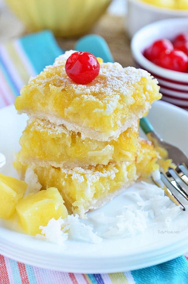Channel the tropics, lounging on a white sandy beach, with these Pina Colada Bars. Enjoy the flavors of coconut and pinaple and consider it your ticket to a mental tropical paradise. grab the recipe at cetcu.com