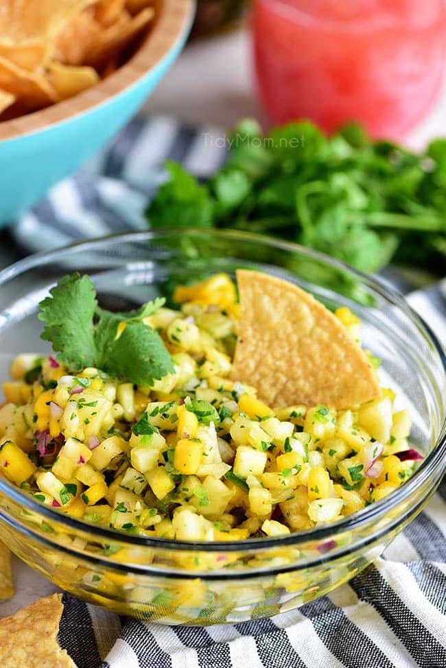 A tropical fruit salsa with a kick of jalapeno that will knock your socks off! This Pineapple Mango Salsa recipe is the perfect addition to any chicken, pork, fish, or tacos. Print full recipe at cetcu.com