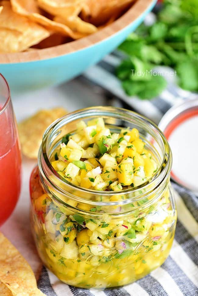 A tropical fruit salsa with a kick of jalapeno that will knock your socks off! This Pineapple Mango Salsa recipe is the perfect addition to any chicken, pork, fish, or tacos. Print full recipe at cetcu.com