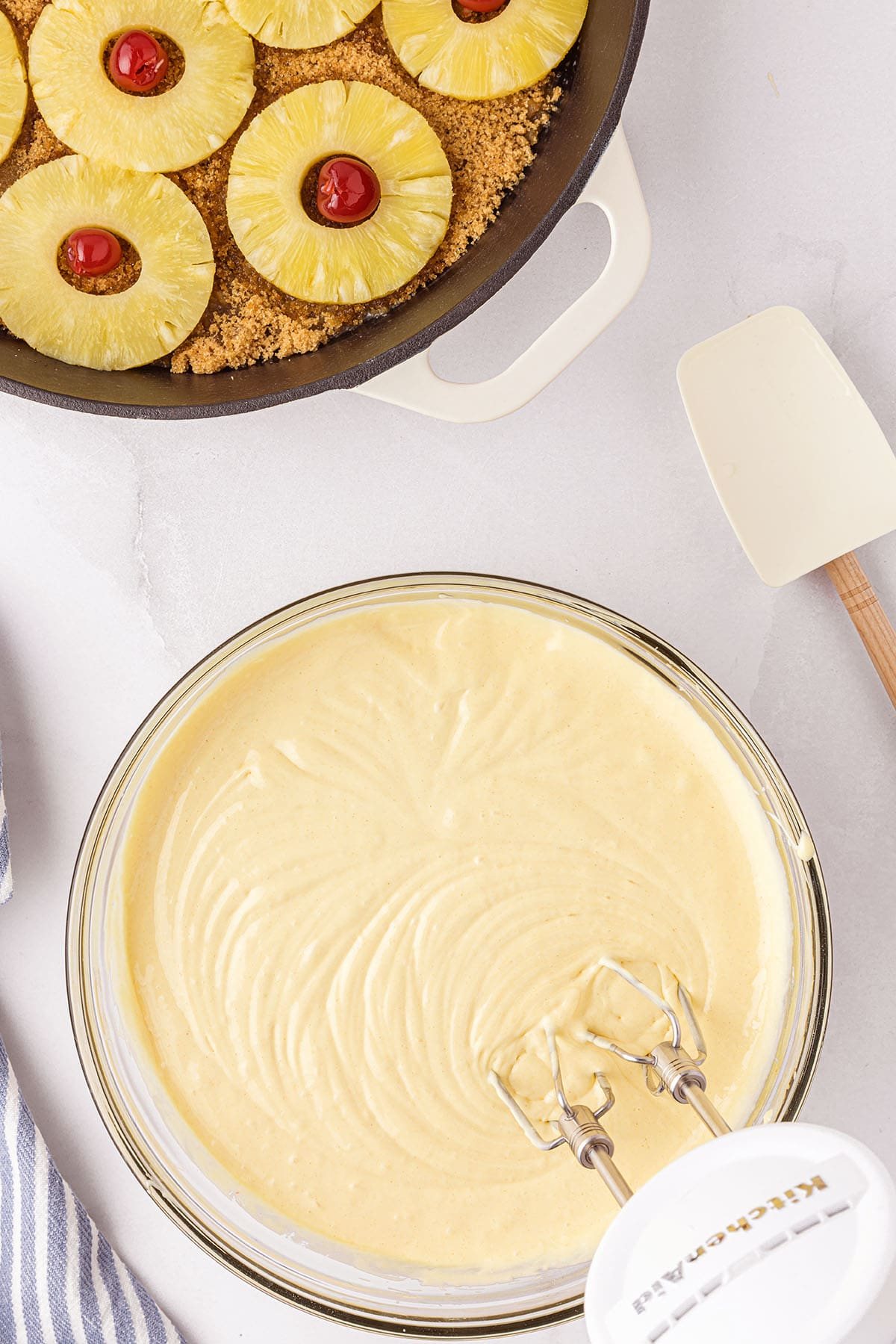 mixing cake batter for Pineapple Upside Down Cake