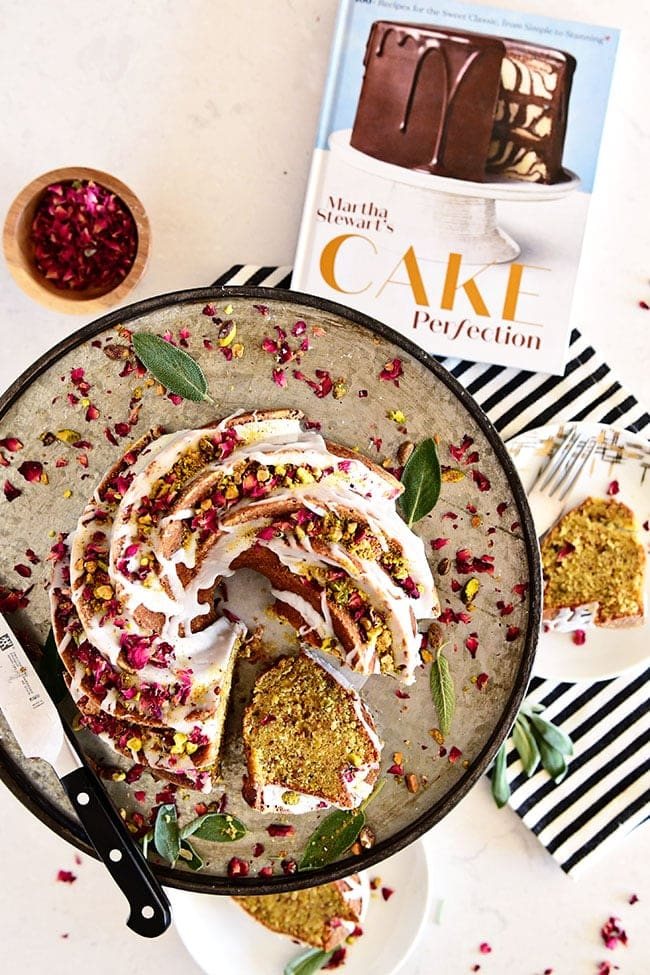 Pistachio Bundt Cake with cut piece and Martha Stewart cookbook along side