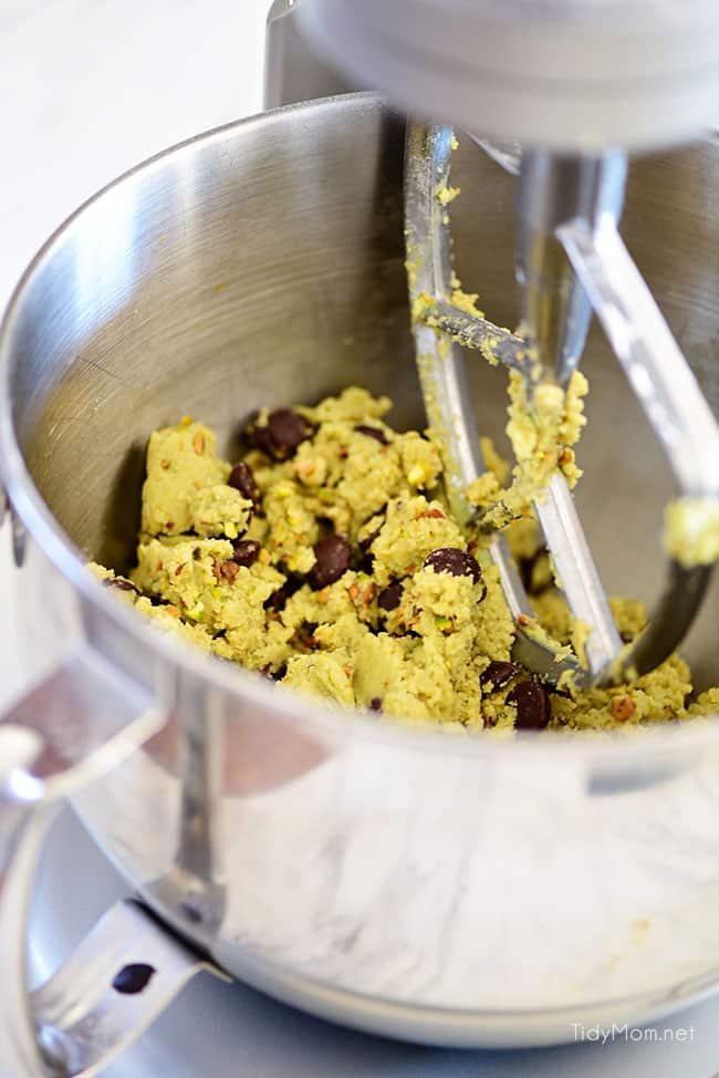 Pistachio cookies are sure to become a favorite! Perfect for St. Patricks Day, Easter, Christmas or any day. These deliciously soft pudding cookies are buttery and salty with dark chocolate chunks that pairs perfectly with chopped pistachios. I bet you can’t eat just one! Get the full printable recipe at cetcu.com
