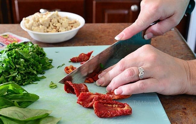 Chopping vegetables for Pizza Bread. Recipe at cetcu.com