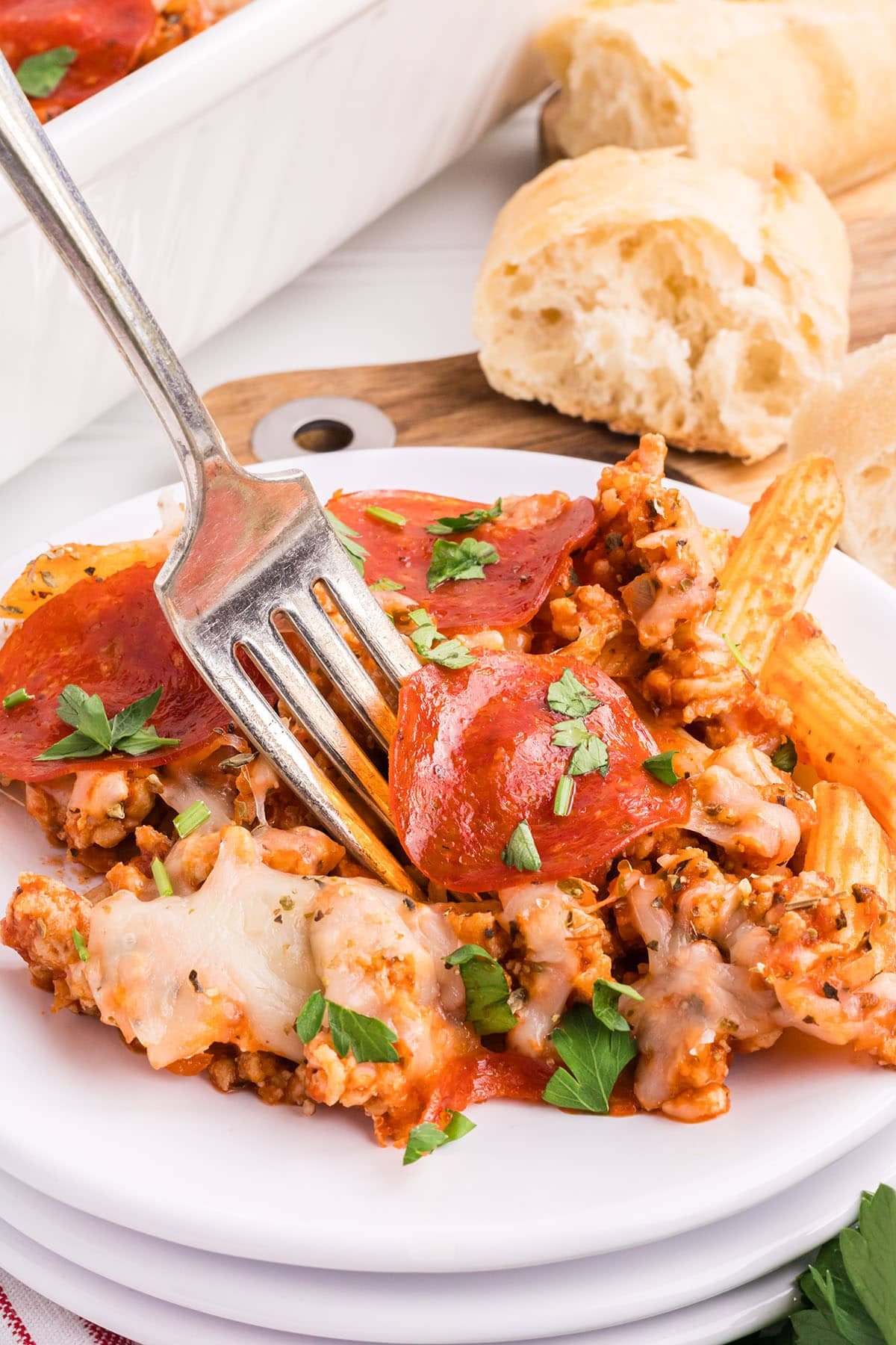 pizza pasta casserole on a plate with a fork