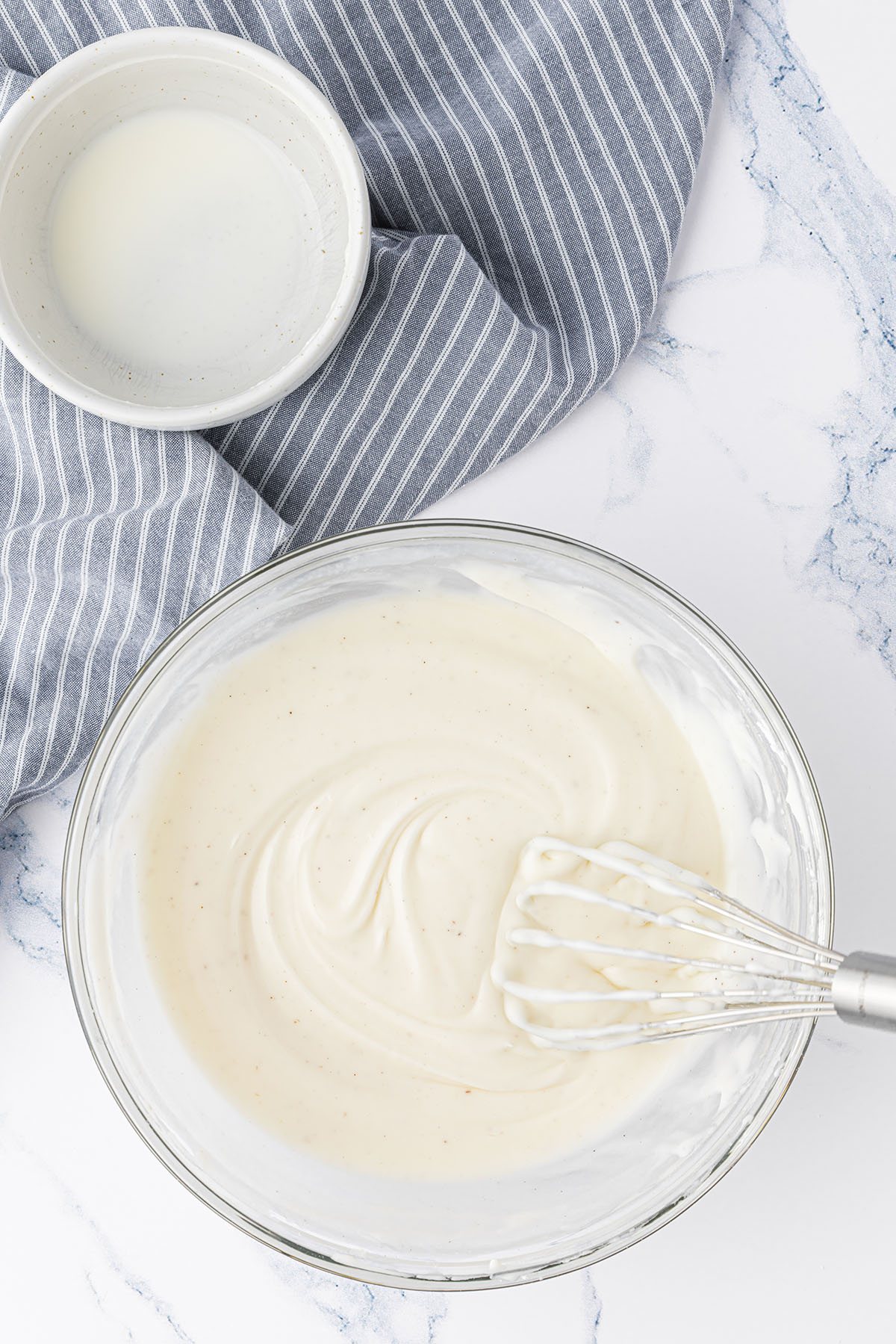 almond glaze in a glass mixing bowl