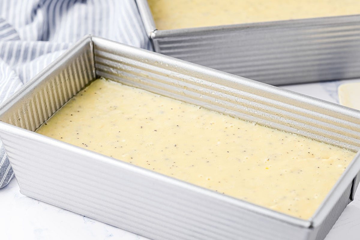 bread batter poured into loaf pans
