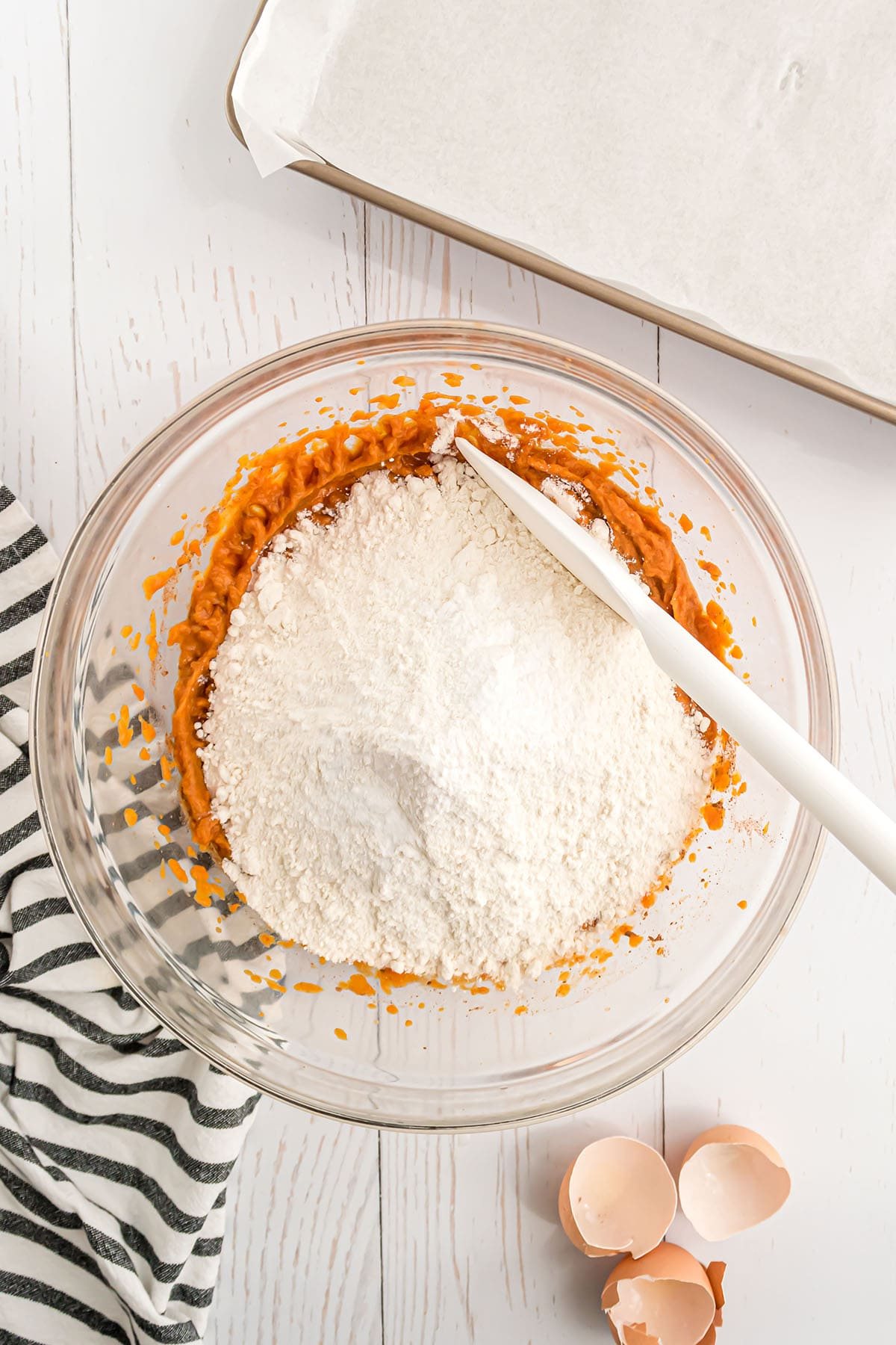 ingredients for a pumpkin coffee cake in a glass bowl