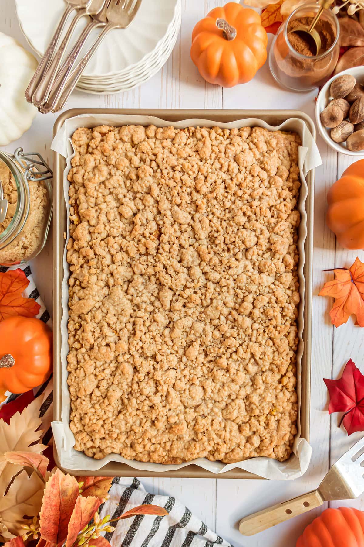 baked pumpkin coffee cake in a 9x13 pan with crumb topping