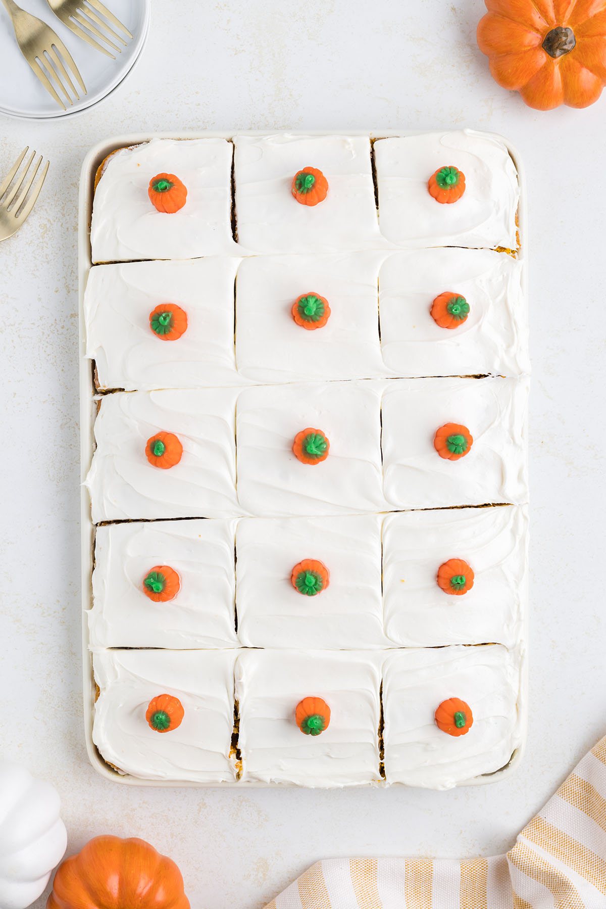 pumpkin sheet cake topped with candy pumpkins and cut into 15servings.