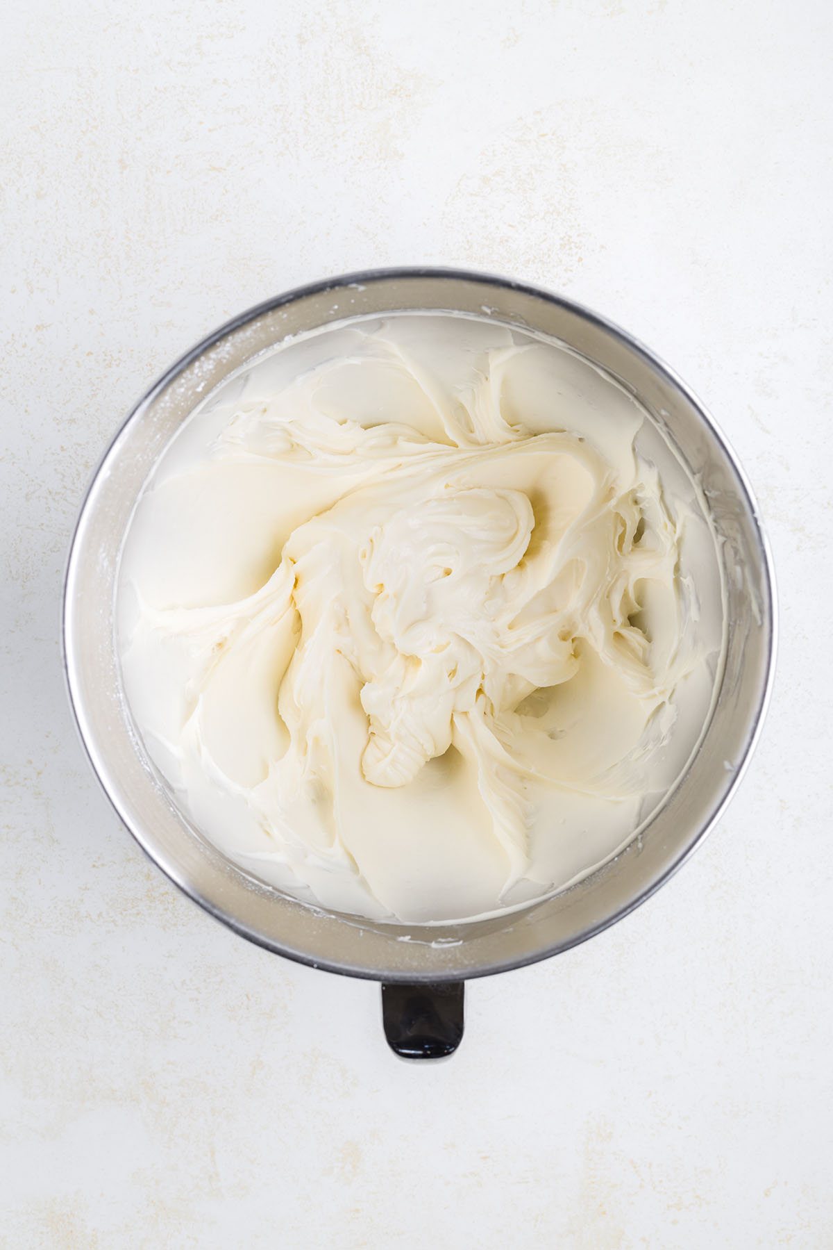 cream cheese frosting in mixing bowl