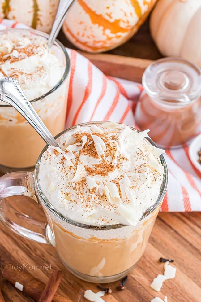 pumpkin hot chocolate in a glass mug with a spoon