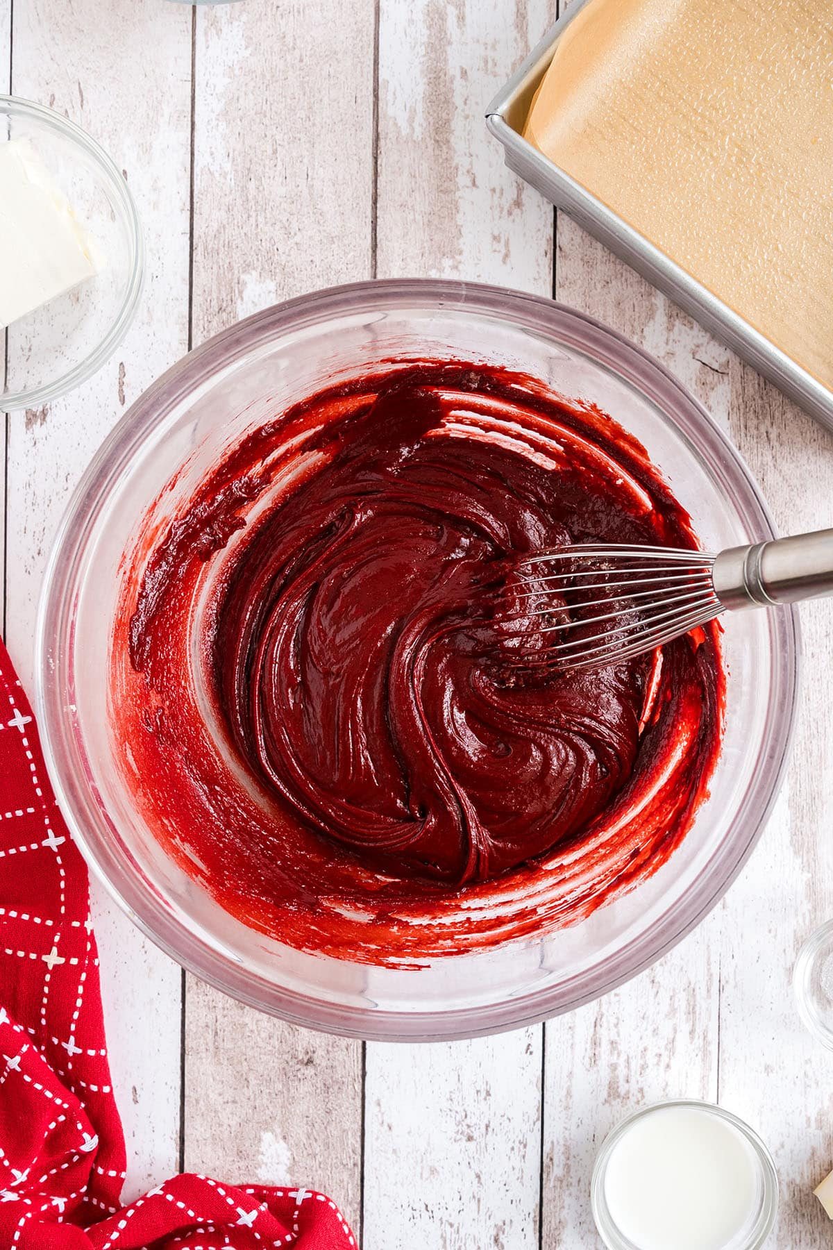 red velvet brownie batter in glass mixing bowl