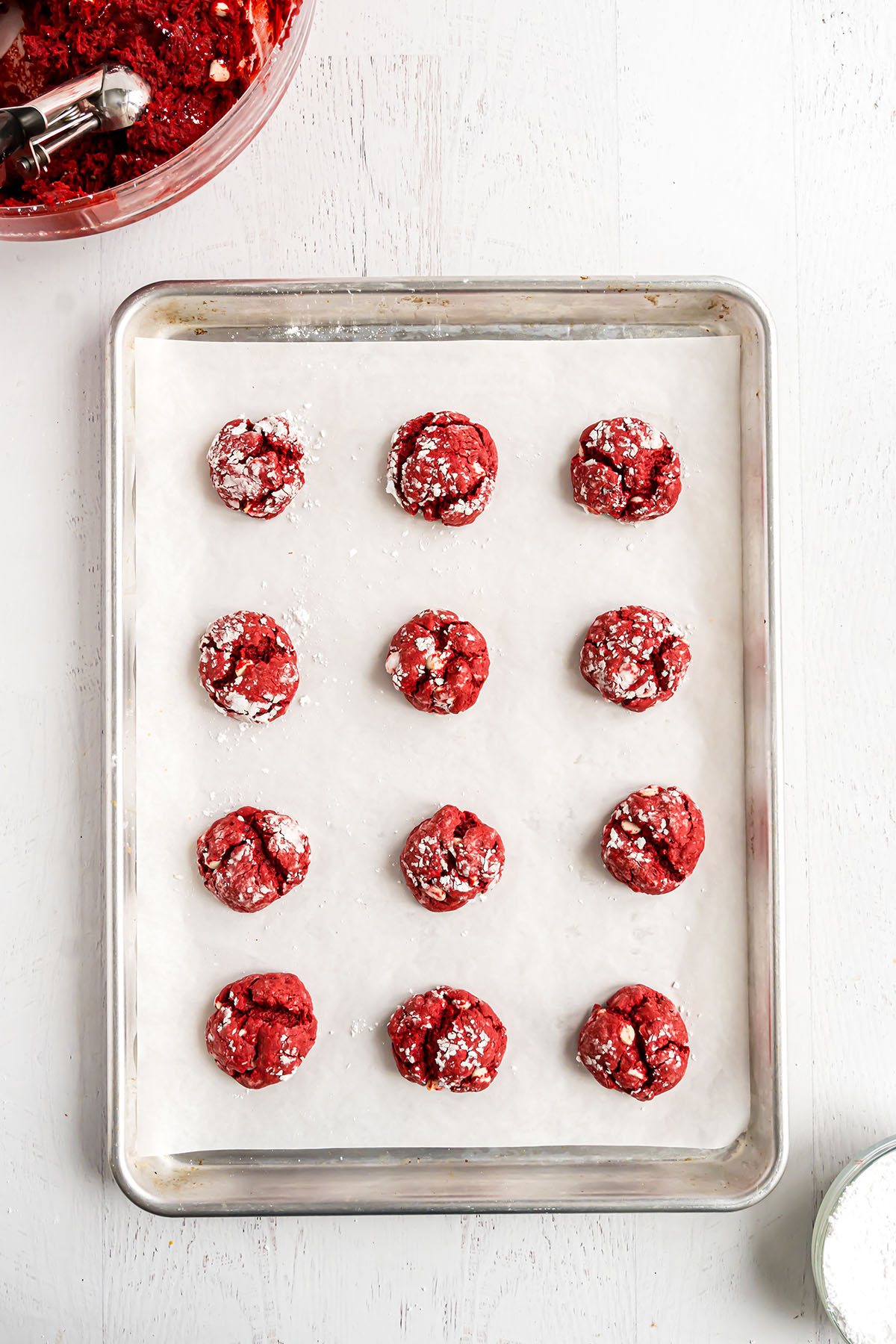 red velvet gooey butter cookies on baking sheet