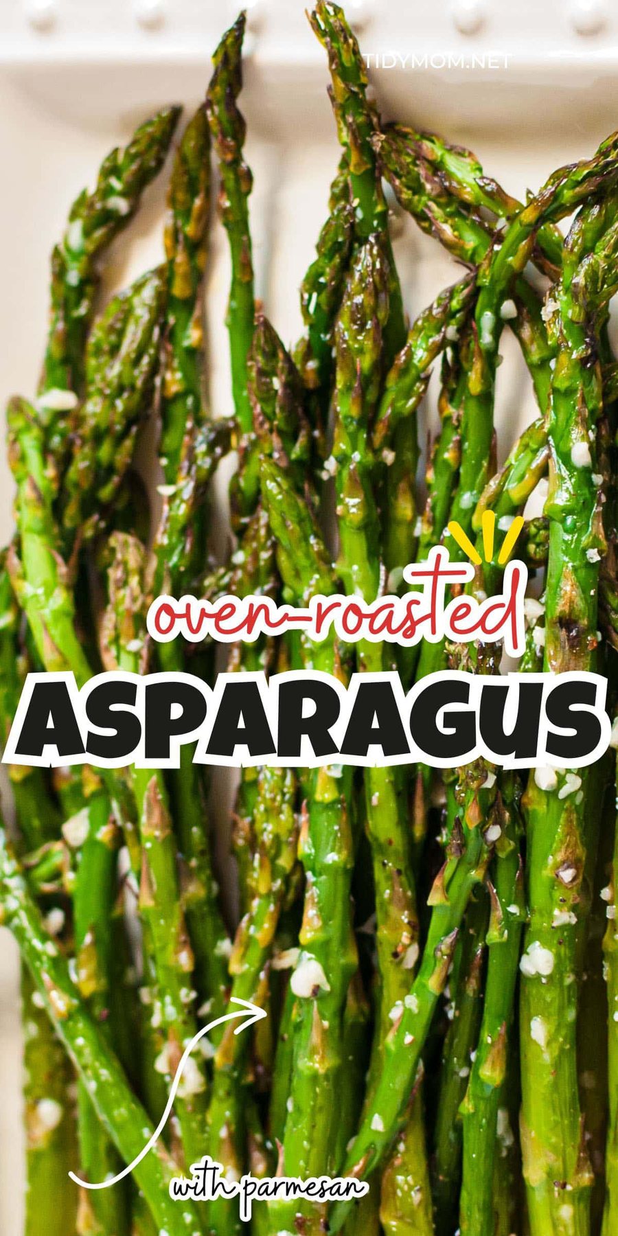 oven baked asparagus with parmesan on a white tray.