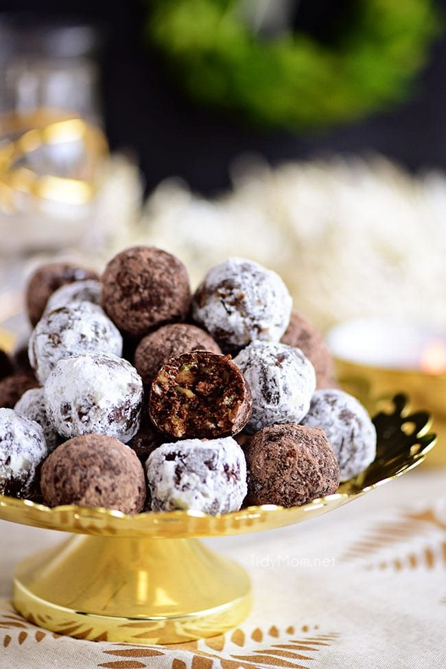 Rum Balls stacked on a gold cake stand
