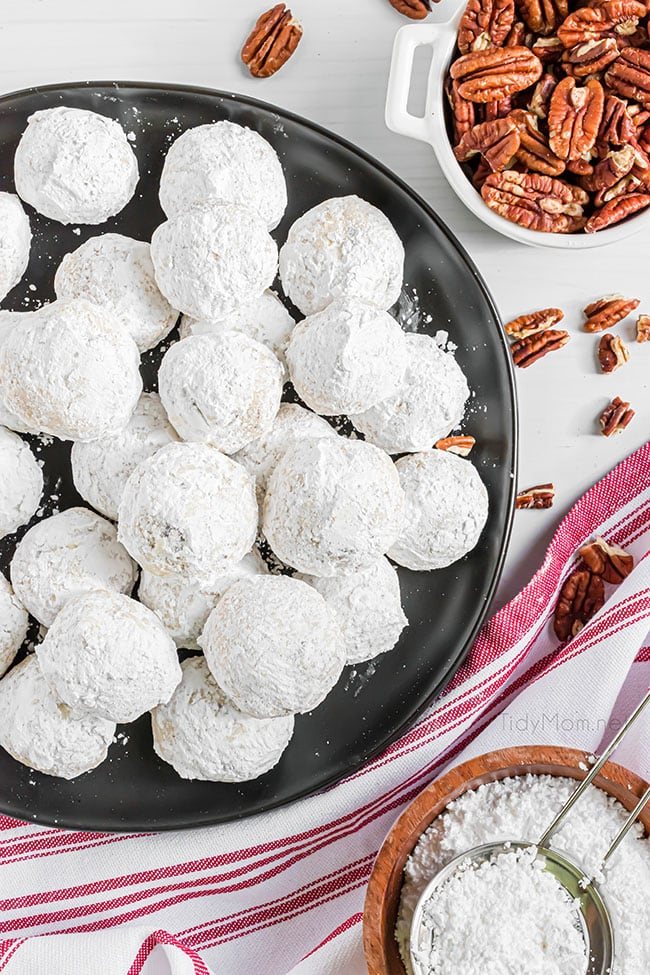 wedding cookies on a black tray